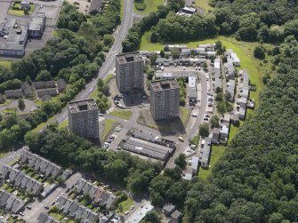 Oblique aerial view of Berryhill Road centred on the tower blocks, taken from the N.