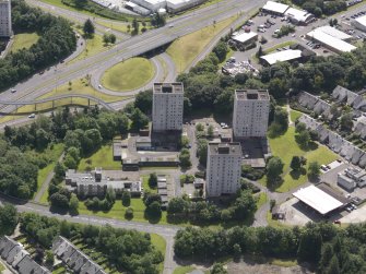 Oblique aerial view of Hume Road centred on the tower blocks, taken from the WNW.