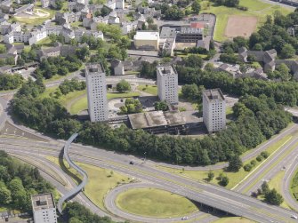 Oblique aerial view of Burns Road centred on the tower blocks, taken from the W.