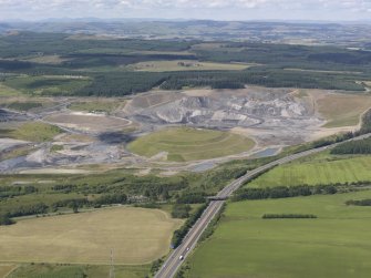 General oblique aerial view of the St Ninian's Open cast Mine centred on the Charles Jenks' landscaped feature, taken from the ENE.