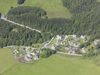 General oblique aerial view of the village of Blair Atholl centerd on the Old Bridge Of Tilt, taken from the SE.