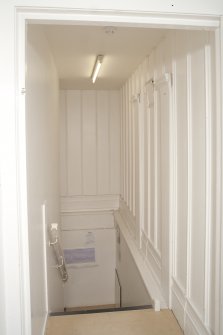 Interior. Detail of inserted staircase and original panelling.