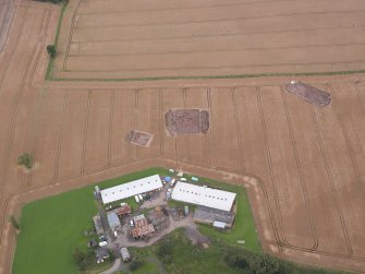 Oblique aerial view centred on the Glasgow University excavation trenches, looking N.