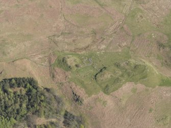 Oblique aerial view of the remains of the farmstead, looking NE.