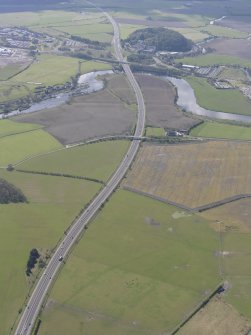 General oblique aerial view along the M9 with Craigforth House in the distance, looking S.