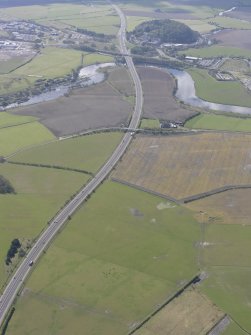 General oblique aerial view along the M9 with Craigforth House in the distance, looking SSE.