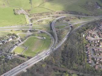 Oblique aerial view of the junction of the A898 and the Great Western Road, looking NE.