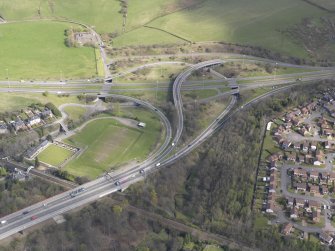 Oblique aerial view of the junction of the A898 and the Great Western Road, looking NNE.