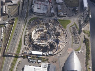 Oblique aerial view of the Scottish Exhibition and Conference Centre showing construction of the Hyrdo, looking SE.