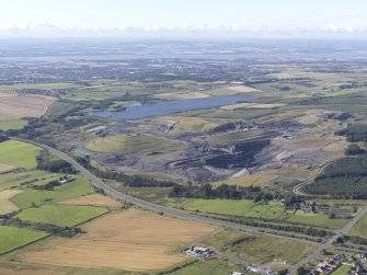 General oblique aerial view of St Ninian's Open Cast Mine, centred on the Sculptured Landscape by Charles Jenks, taken from the NE.