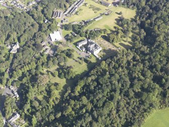 Oblique aerial view of Newbattle Abbey House, taken from the SE.