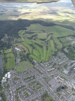 General oblique aerial view of Peebles centred on Peebles Golf Course, taken from the SE.