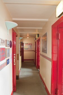 Ground floor. Corridor at rear of auditorium  from south east.