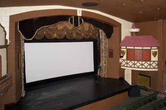 Auditorium. Stage and screen from balcony to east.