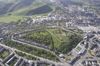 General oblique aerial view of Holyrood Park, Arthurs Seat, Calton Hill, Canongate and Royal Terrace Gardens, looking S.
