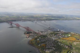 General oblique aerial view of Forth Rail Bridge, Forth Road Bridge, North Queensferry and construction of Queensferry Crossing, looking SW.