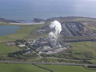 General oblique aerial view of Dunbar, Oxwell Mains Cement Works, Limestone Quarry, looking NE.