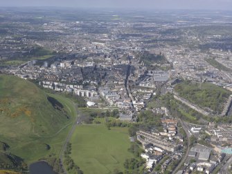 General oblique aerial view of Holyrood Park, Calton Hill, Royal Mile, Old Town and New Town, looking W.