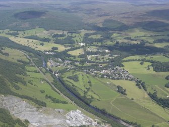 General oblique aerial view of Blair Atholl with Blair Castle beyond, looking NW.
