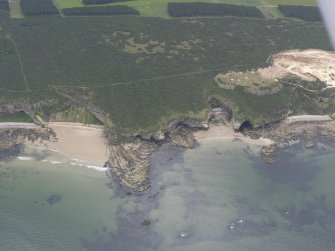 Oblique aerial view of the coastline at Covesea, looking SSE.