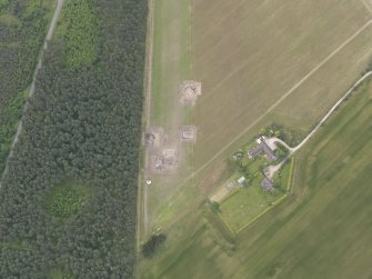 Oblique aerial view of the excavation of the settlement at Clarkly Hill, looking NW.