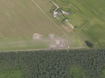 Oblique aerial view of the excavation of the settlement at Clarkly Hill, looking NE.