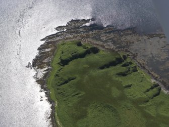 Oblique aerial view of Am Fraoch Eilean and Claig Castle, looking SSE.