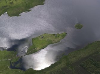 Oblique aerial view of Eilean Mor, Eilean Na Comhairle and Finlaggan Castle, looking S.