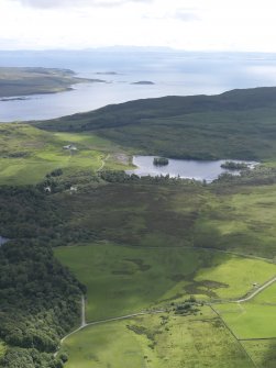 General oblique aerial view of Loch Lossit, Eilean Mhiciain and Eilean Fraoich, looking SE.