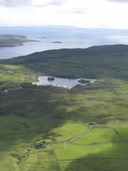 General oblique aerial view of Loch Lossit, Eilean Mhiciain and Eilean Fraoich, looking SE.