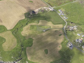 Oblique aerial view of Ardnish showing the parchmarks of the possible enclosure, looking W.