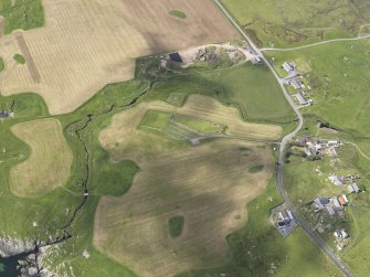 Oblique aerial view of Ardnish showing the parchmarks of the possible enclosure, looking W.