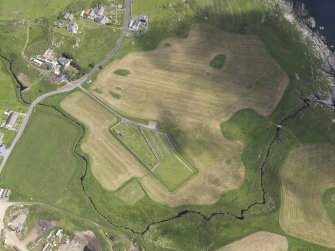 Oblique aerial view of Ardnish showing the parchmarks of the possible enclosure, looking NE.