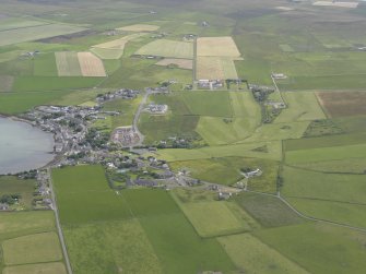 General oblique aerial view of St Margarets Hope and South Ronaldsay Golf Course, looking SE.
