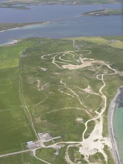 General oblique aerial view of The Bu, Burray, South Ronaldsay and Churchill Barrier No. 2, looking NNW.