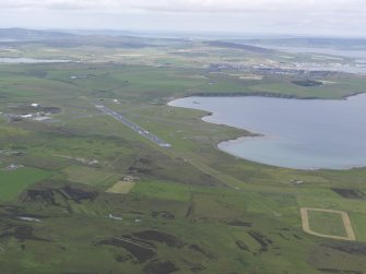 General oblique aerial view of Kirkwall Airport and Inganess Bay, looking NW.