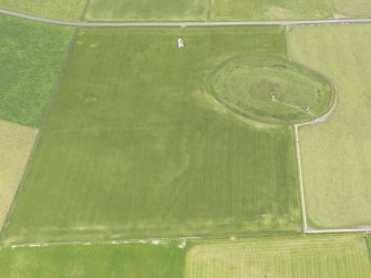 Oblique aerial view of Maeshowe Chambered Cairn, looking NNE.