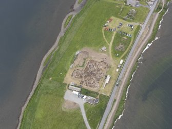 Oblique aerial view of the excavations at Ness of Brodgar, looking NW.