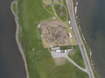 Oblique aerial view of the excavations at Ness of Brodgar, looking NNW.