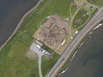 Oblique aerial view of the excavations at Ness of Brodgar, looking W.