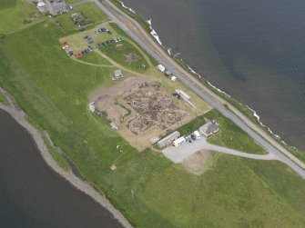 Oblique aerial view of the excavations at Ness of Brodgar, looking NNW.