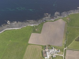 Oblique aerial view centred on the Hillock of Burroughston broch, looking E.