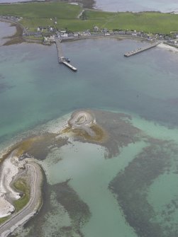 Oblique aerial view of Whitehall Village, Stronsay over the Point of Graand, looking S.