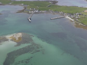 Oblique aerial view towards Whitehall Village, Stronsay over the Point of Graand, looking S.