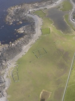 Oblique aerial view centred on the enclosures and planticrues, and the Old Beacon, looking S.