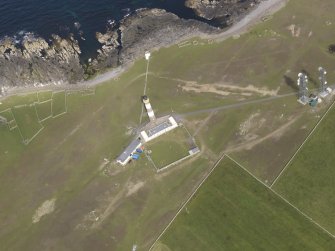 Oblique aerial view centred on the lighthouse, looking E.