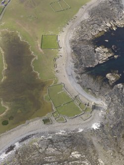 Oblique aerial view centred on the enclosures and planticrues, and the Old Beacon, looking N.