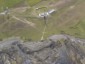 Oblique aerial view centred on the lighthouse, looking W.