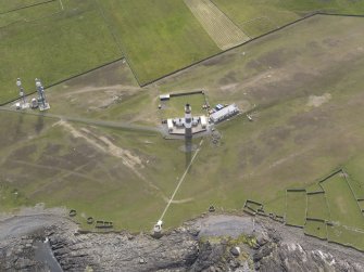 Oblique aerial view centred on the lighthouse, looking W.