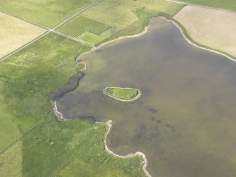 Oblique aerial view of the Loch of Wasbister, centred on the Burrian, looking N.